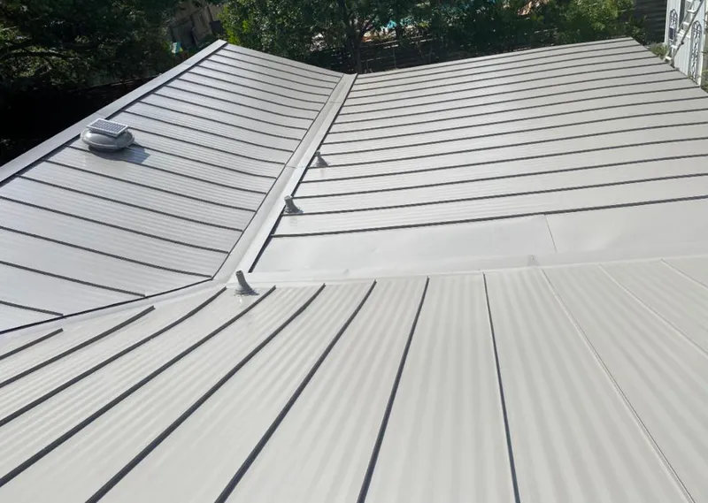 Solar attic fan installed on a metal roof for Roof Ventilation in Pukalani